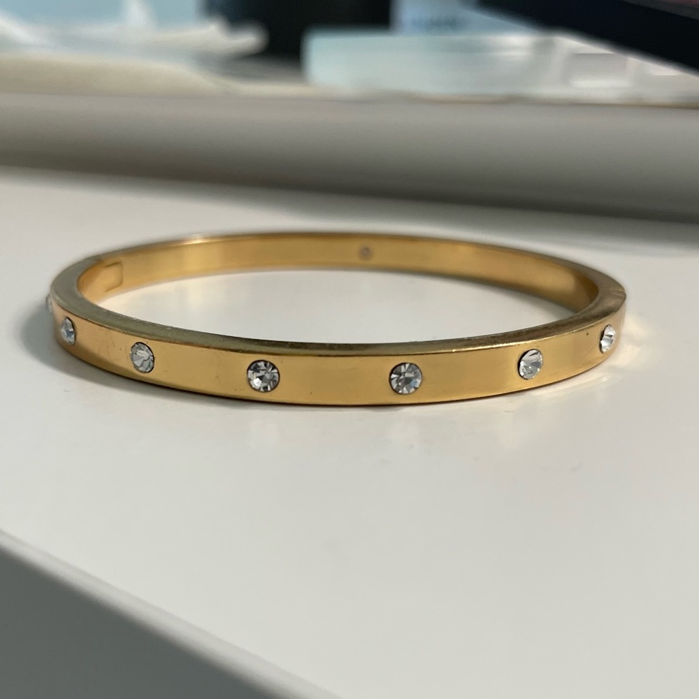 Kate Spade set in stone hinged bangle gold tone